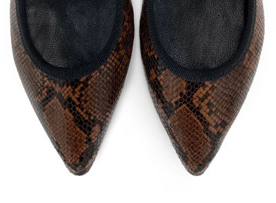 Pointed toe brown animal print leather flats