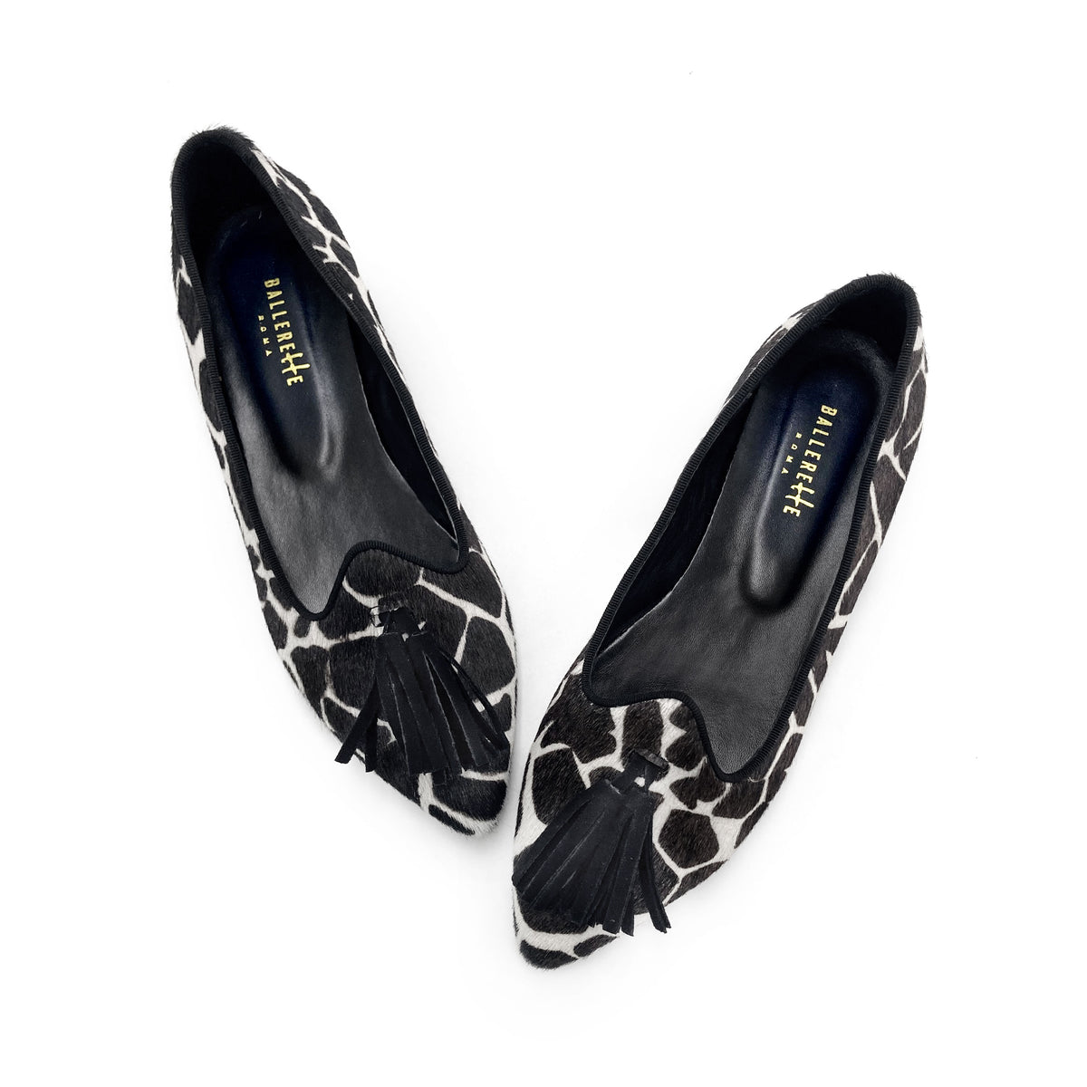 Women's black and white animal print pointed toe moccasins