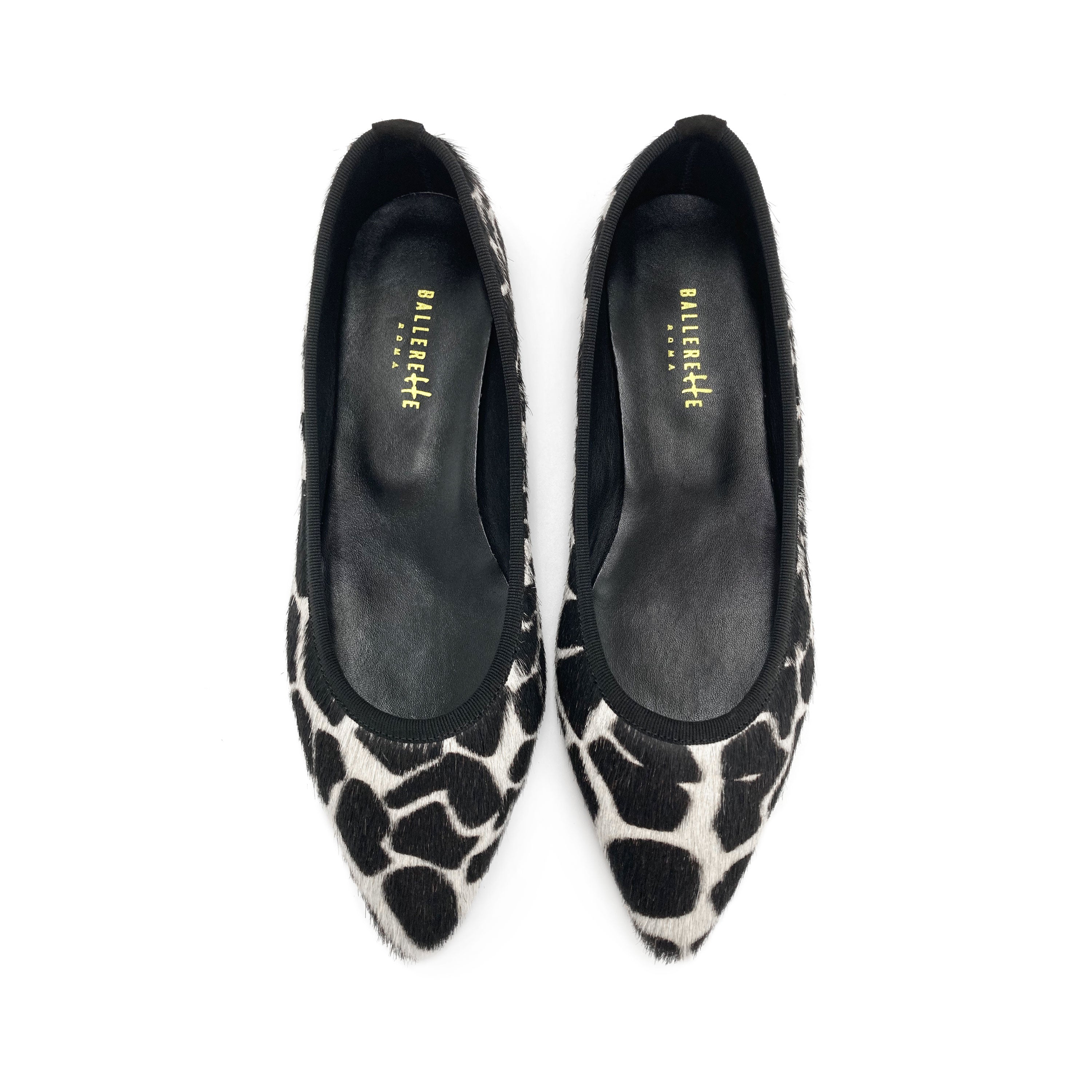 Ballerine a punta animalier in cavallino maculato bianco e nero
