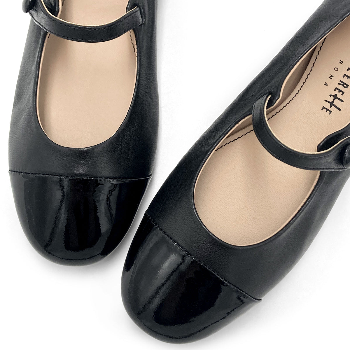 Black leather ballet flats with patent leather strap and toe