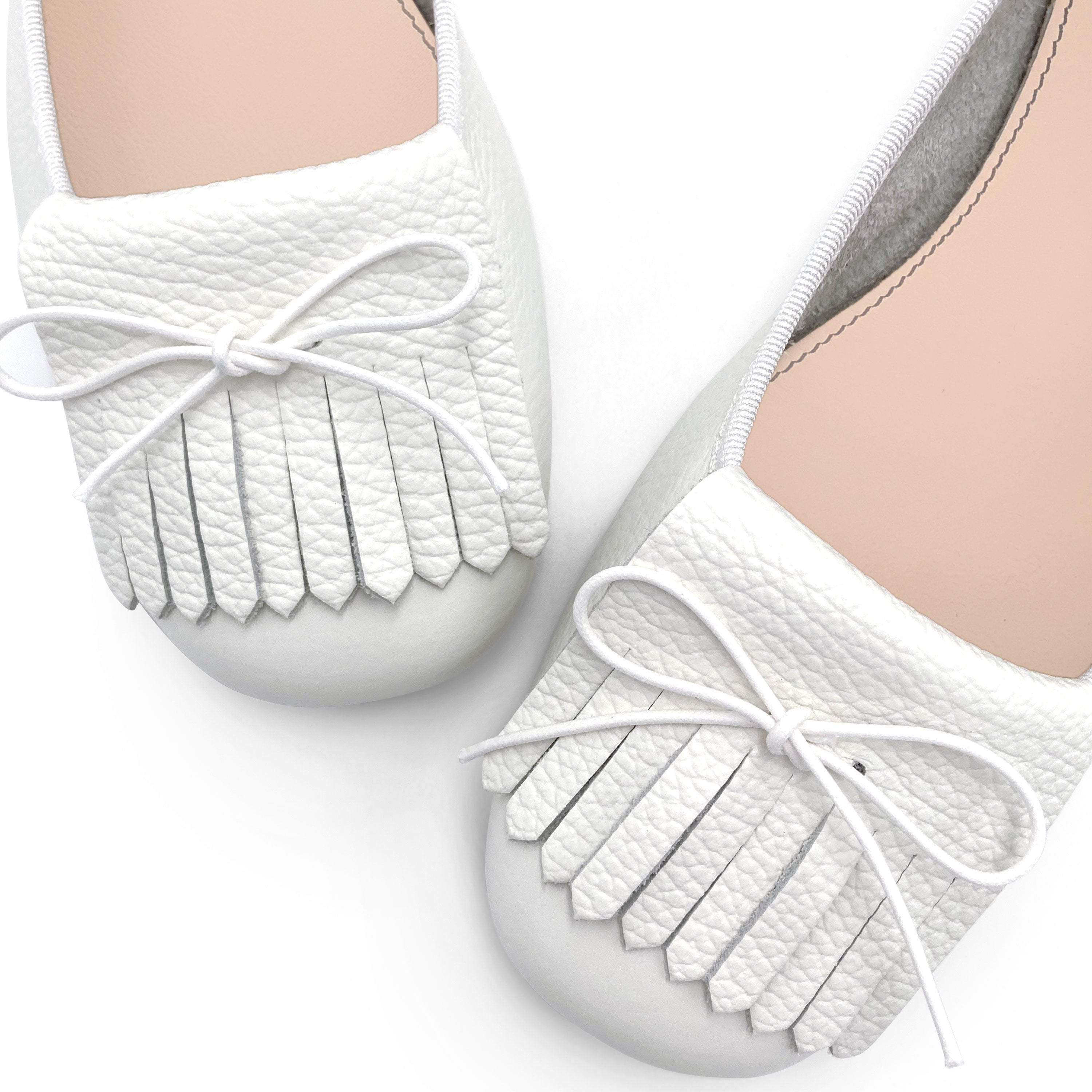 White leather moccasins with fringe tassel