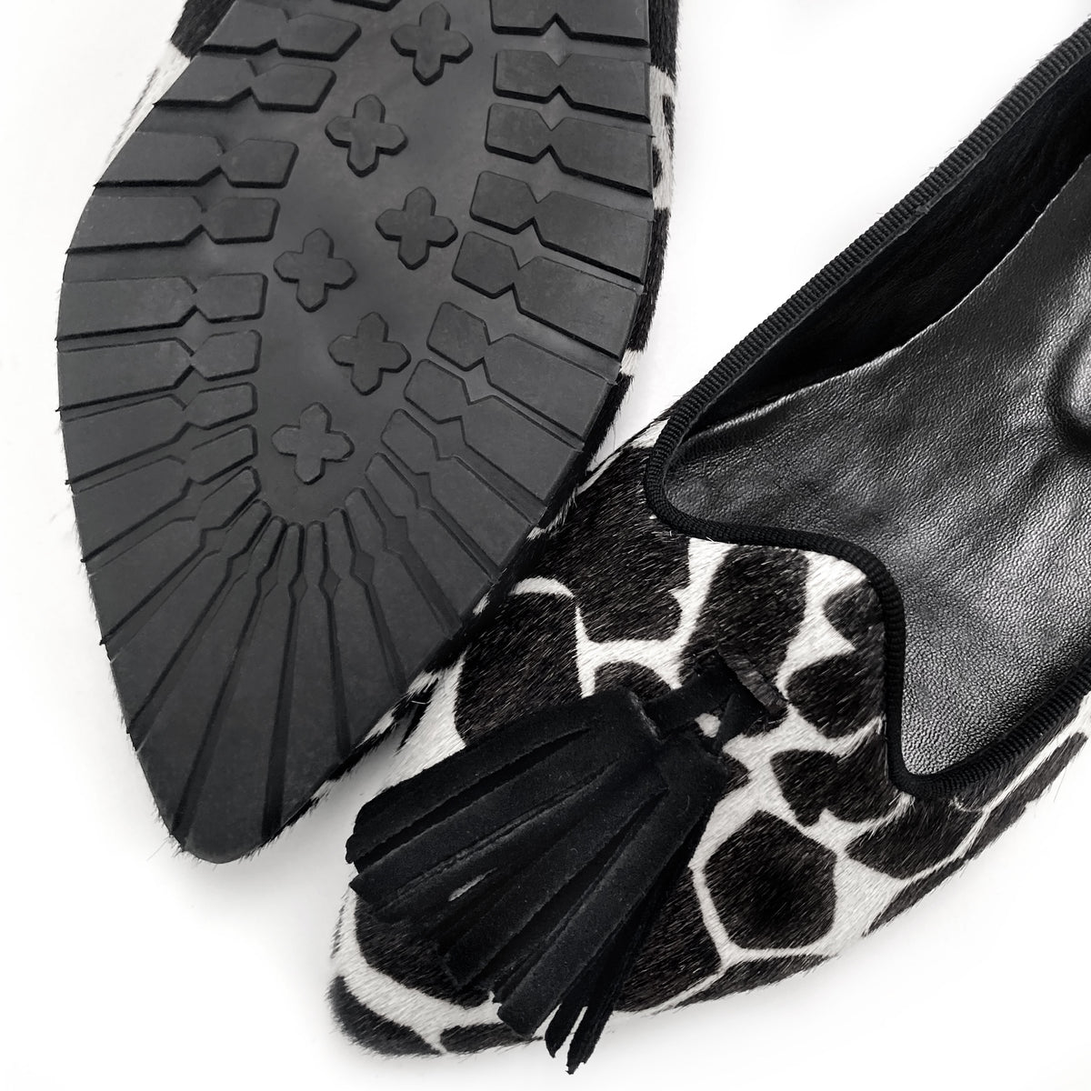 Women's black and white animal print pointed toe moccasins